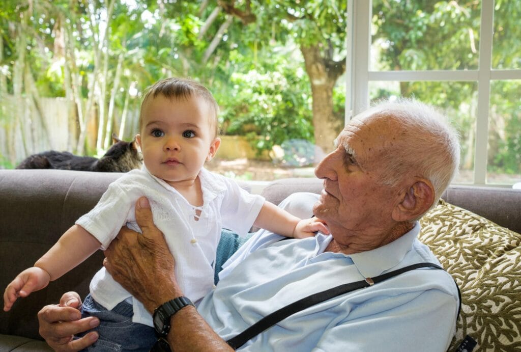 grandpa holding grandchild